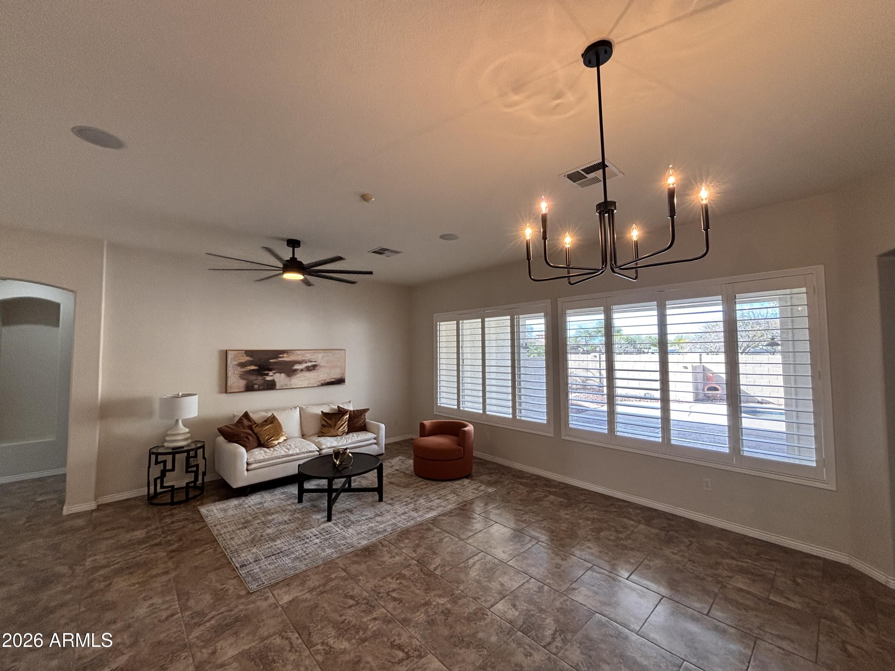 434 East Sheffield Avenue Gilbert, AZ 85296 - Photo 12 of 52 a view of a livingroom with furniture and a ceiling fan
