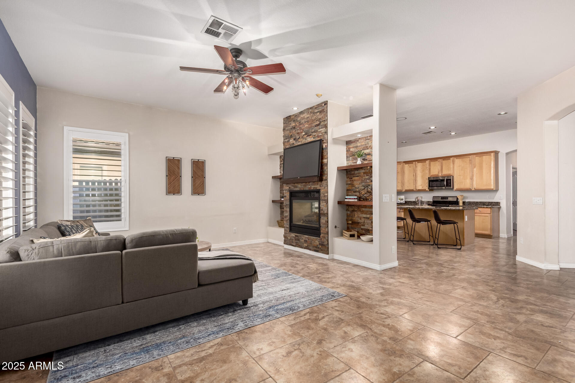 434 East Sheffield Avenue Gilbert, AZ 85296 - Photo 13 of 52 a living room with furniture and kitchen view
