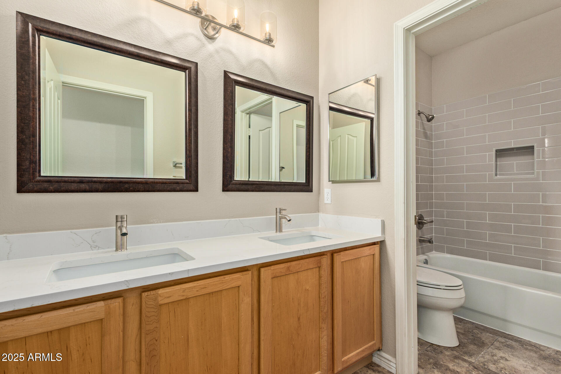 434 East Sheffield Avenue Gilbert, AZ 85296 - Photo 16 of 52 a bathroom with 2 sink toilet and a mirror