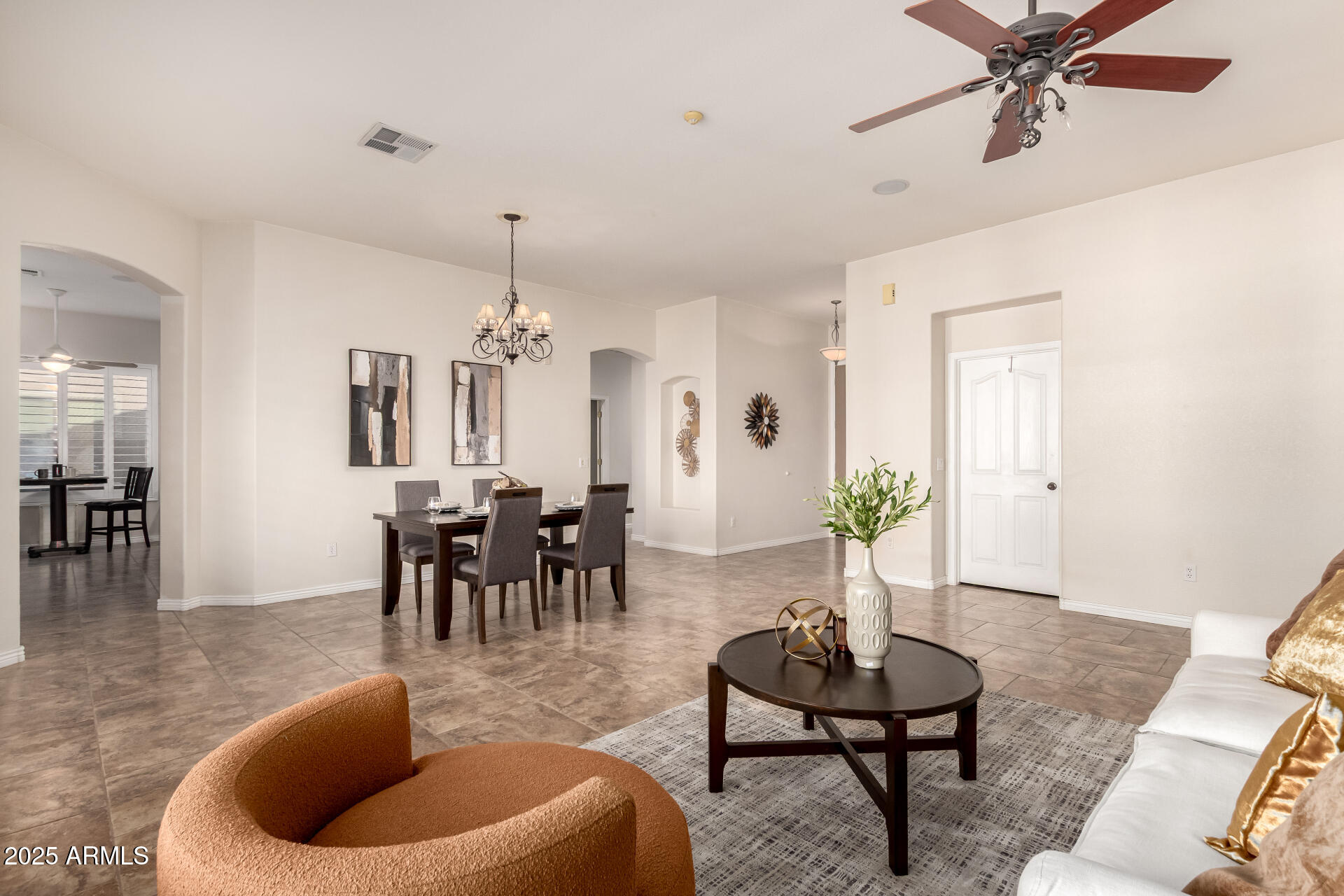 434 East Sheffield Avenue Gilbert, AZ 85296 - Photo 21 of 52 a living room with furniture and a chandelier