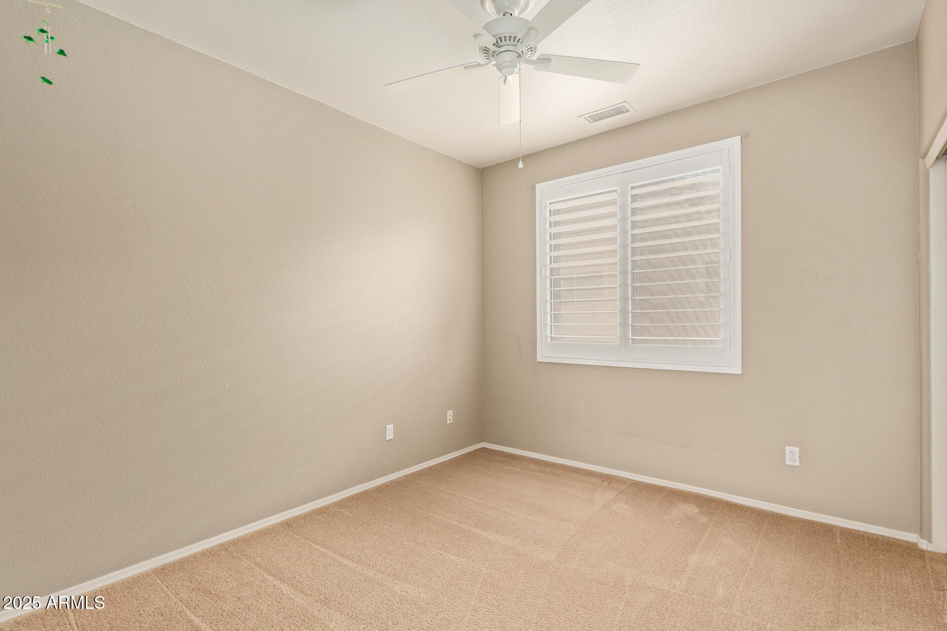 434 East Sheffield Avenue Gilbert, AZ 85296 - Photo 33 of 52 an empty room with a window