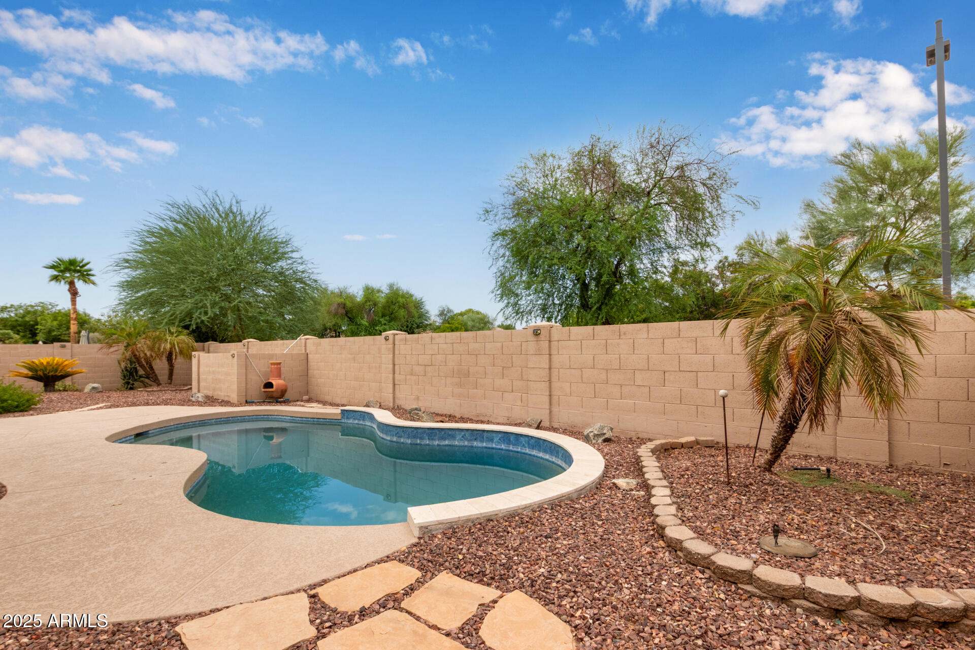 434 East Sheffield Avenue Gilbert, AZ 85296 - Photo 37 of 52 a view of a swimming pool with a patio