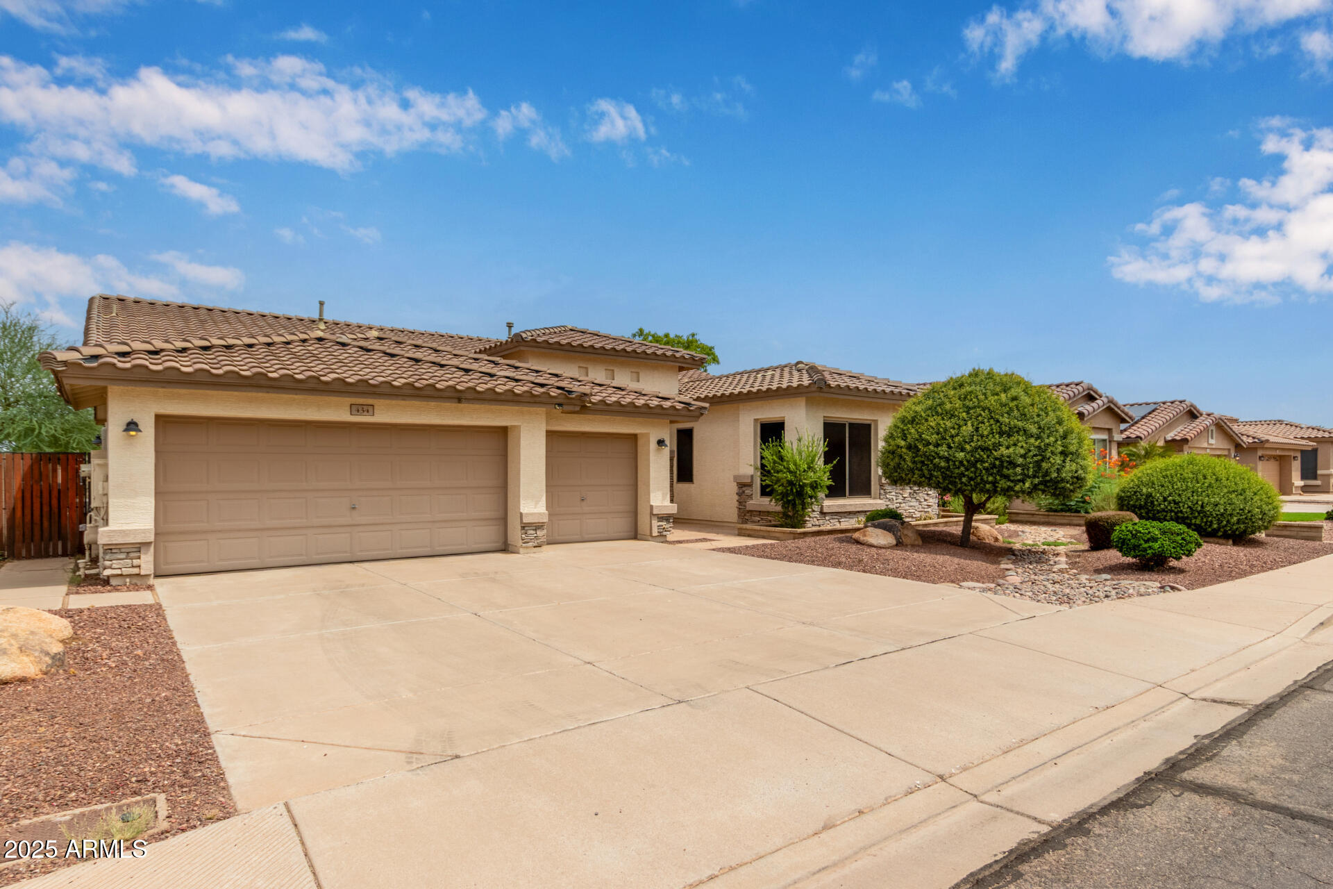 434 East Sheffield Avenue Gilbert, AZ 85296 - Photo 40 of 52 a front view of a house with a yard and garage