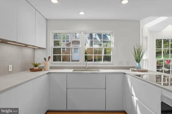 a kitchen with a sink and a window