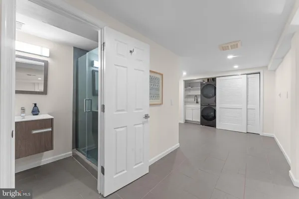 a view of an empty room with a bathroom