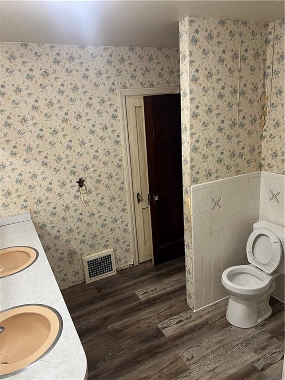 1512 Ridge Avenue New Kensington, PA 15068 - Photo 17 of 20 a bathroom with a granite countertop toilet and a sink