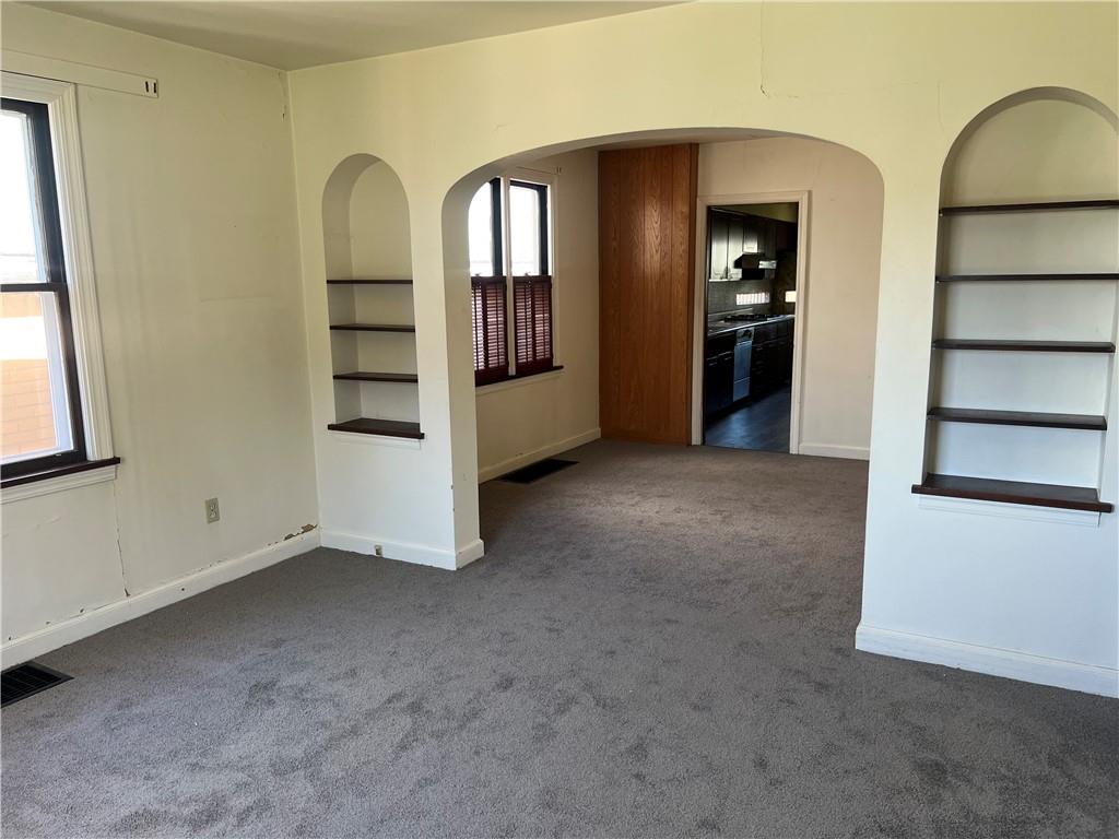 1512 Ridge Avenue New Kensington, PA 15068 - Photo 6 of 20 an empty room with windows and cabinet