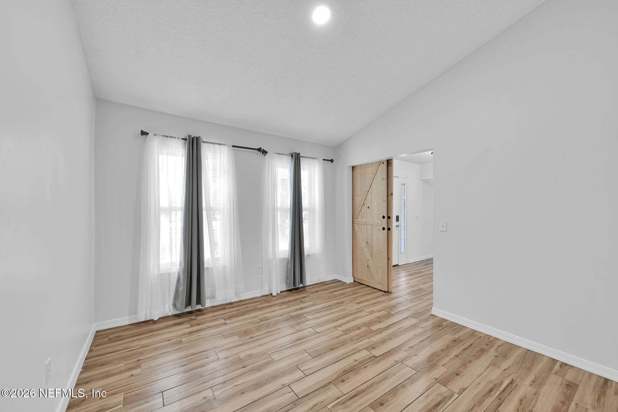 1110 Woodlawn Road, Unit D St. Augustine, FL 32084 - Photo 10 of 40 a view of a room with wooden floor