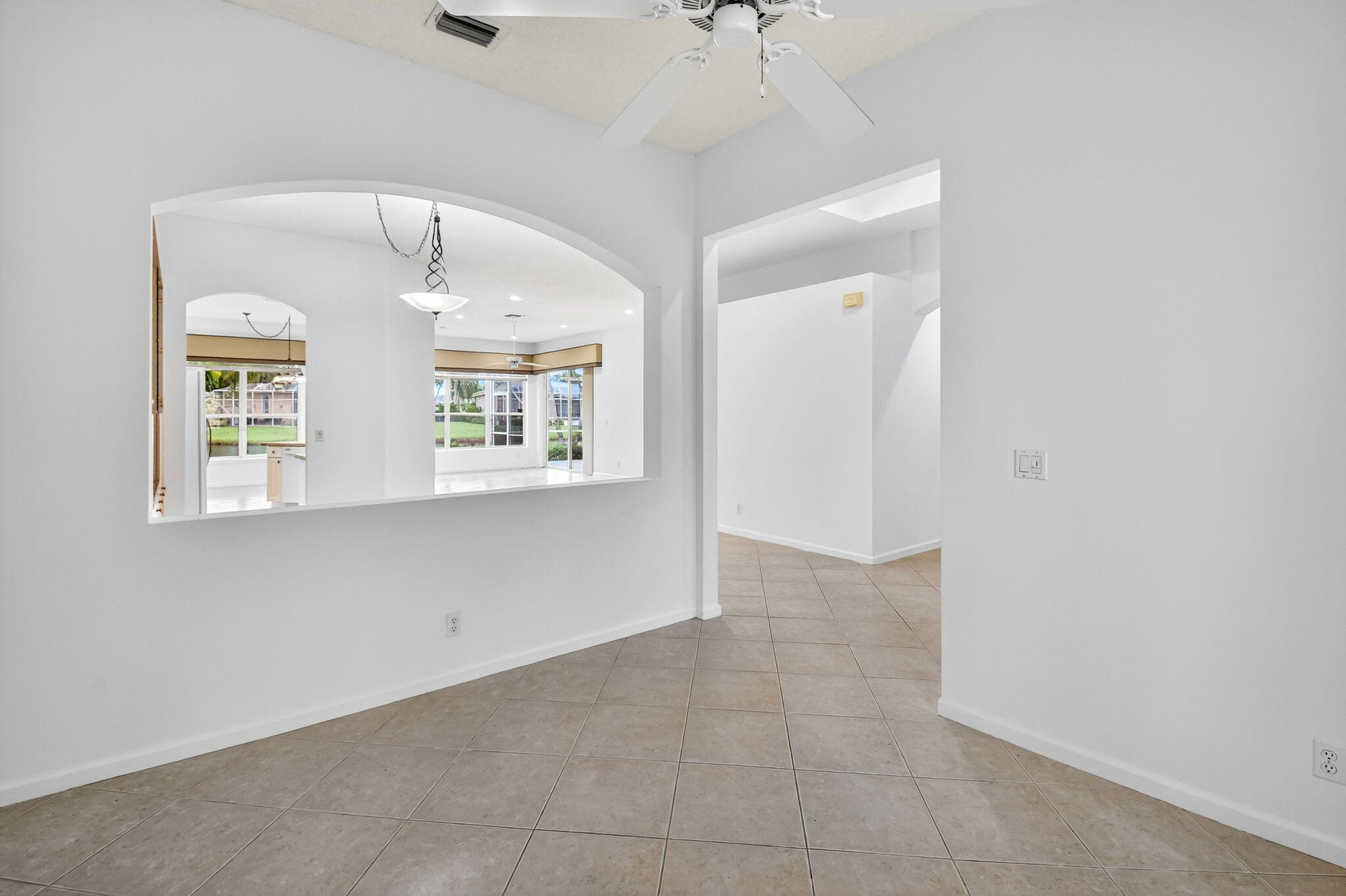 7975 Rockford Road Boynton Beach, FL 33472 - Photo 27 of 79 an empty room with windows and ceiling fan