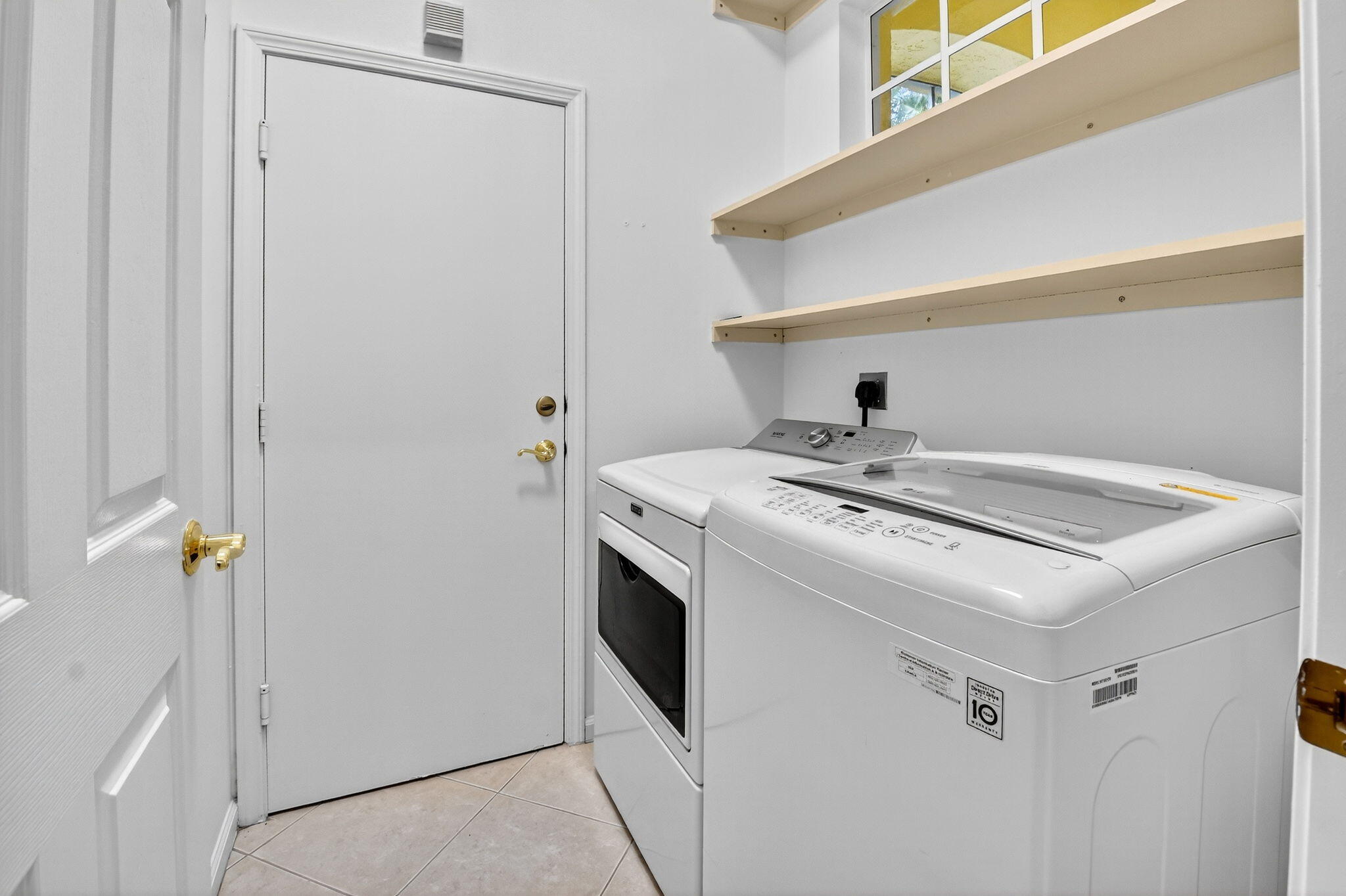 7975 Rockford Road Boynton Beach, FL 33472 - Photo 32 of 79 a utility room with dryer and washer