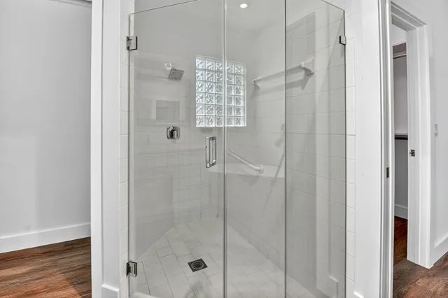 a view of a hallway with dining area and chandelier