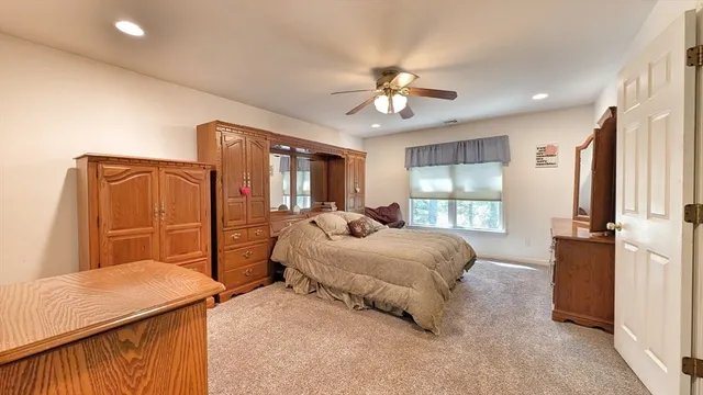a bedroom with bed and window