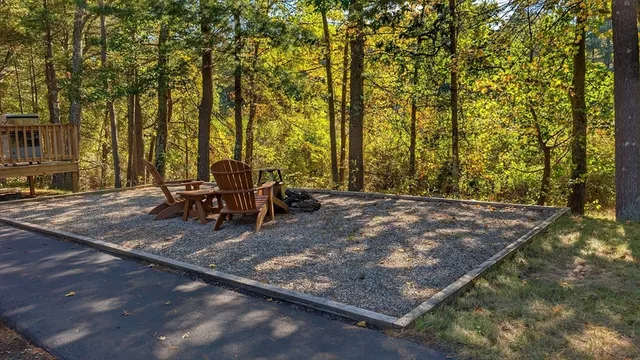a view of a backyard with sitting area
