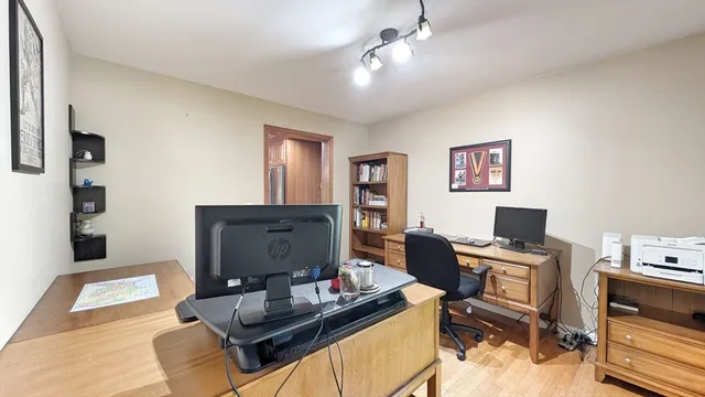 a work room with furniture and wooden floor