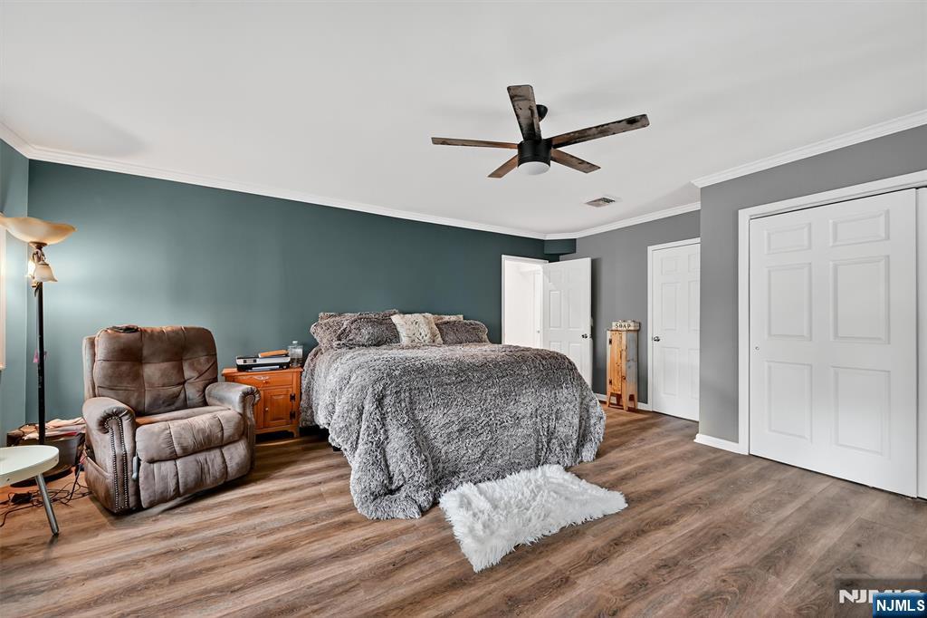 13 Main Street Paterson, NJ 07503 - Photo 13 of 46 a bedroom with a bed and furniture