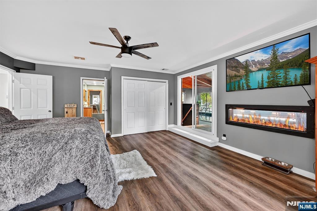 13 Main Street Paterson, NJ 07503 - Photo 14 of 46 a living room with a bed furniture and a flat screen tv