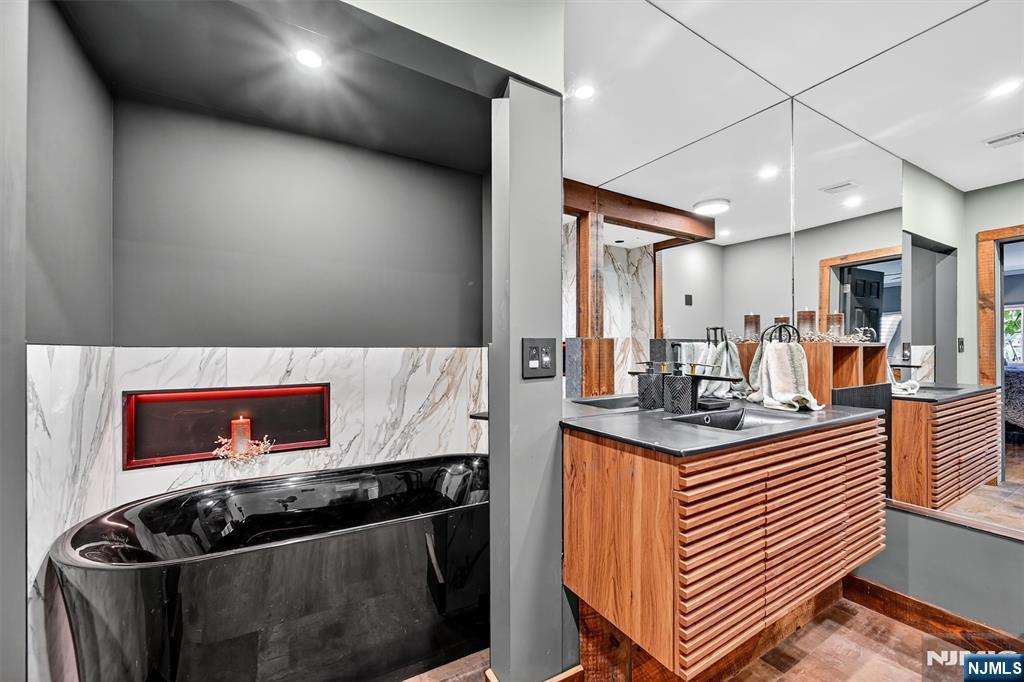 13 Main Street Paterson, NJ 07503 - Photo 17 of 46 a kitchen with stainless steel appliances kitchen island a stove and a sink