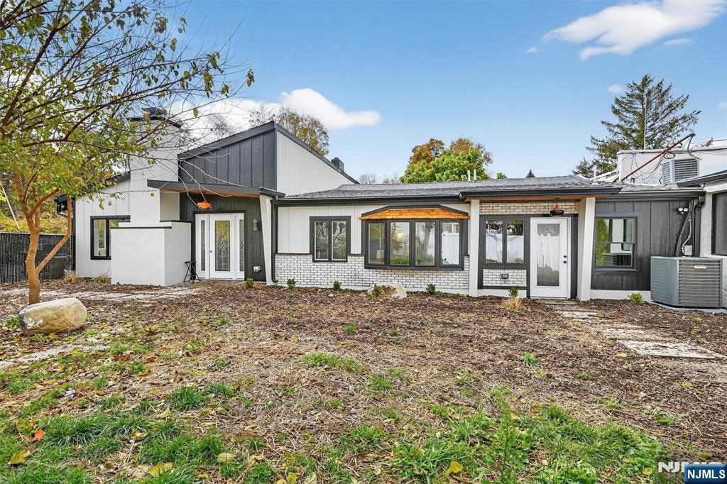 13 Main Street Paterson, NJ 07503 - Photo 2 of 46 a front view of a house with a garden