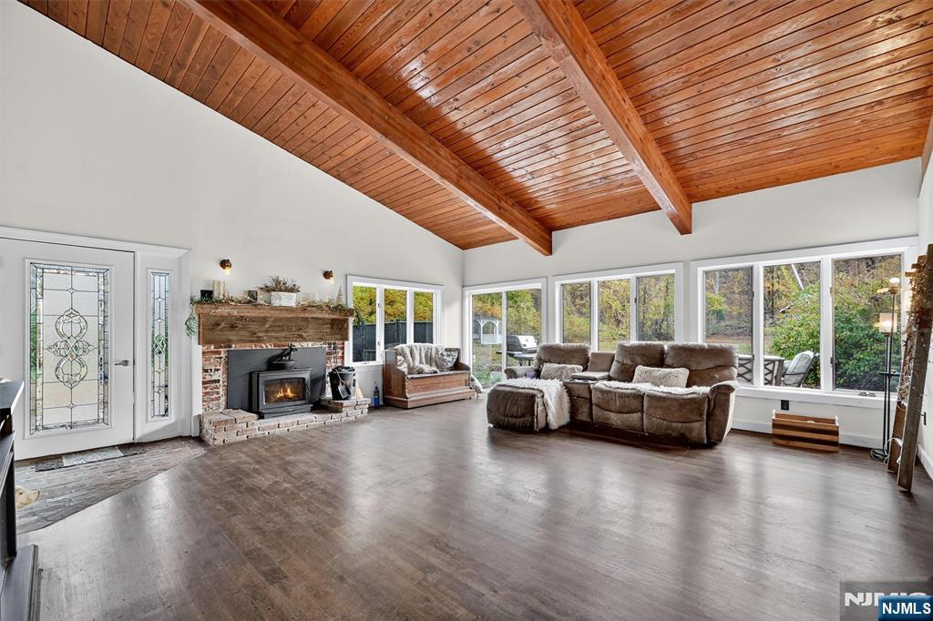 13 Main Street Paterson, NJ 07503 - Photo 23 of 46 a living room with fireplace furniture and a large window