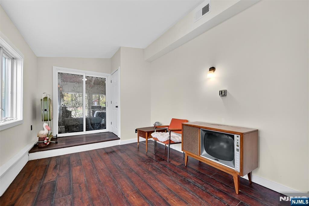 13 Main Street Paterson, NJ 07503 - Photo 28 of 46 a living room with furniture and a fireplace