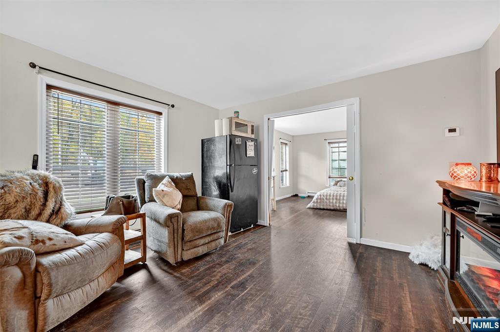 13 Main Street Paterson, NJ 07503 - Photo 31 of 46 a living room with furniture and a flat screen tv