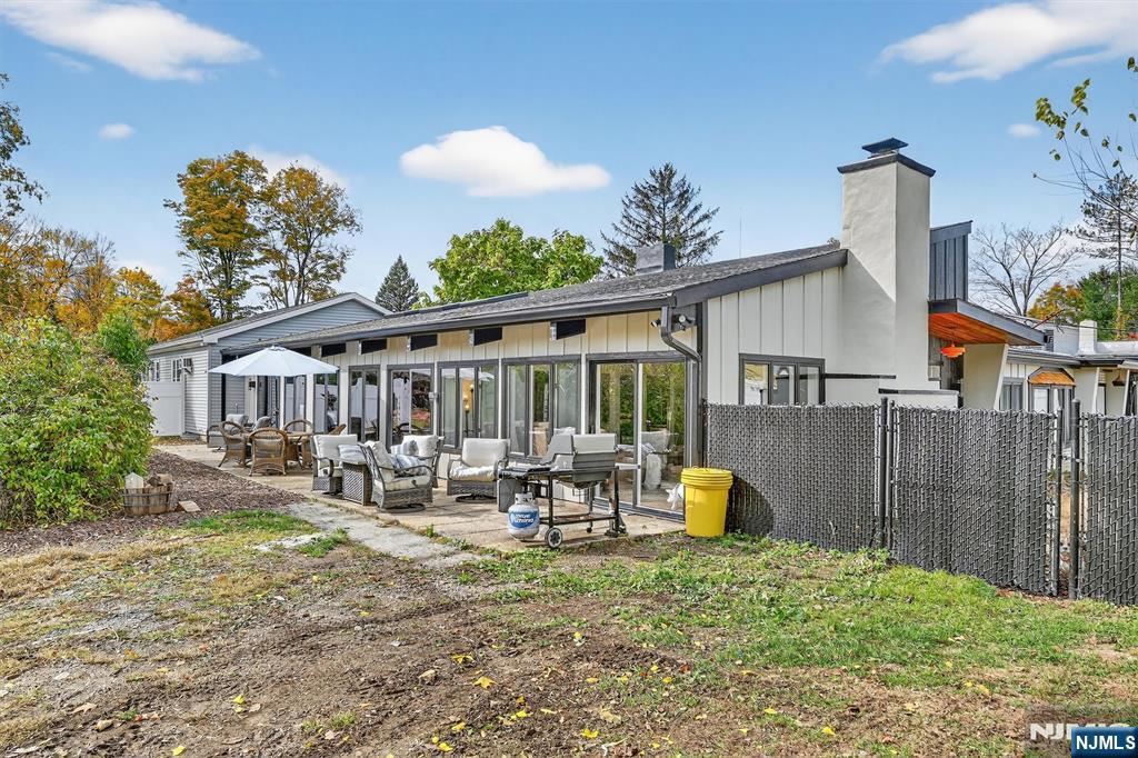 13 Main Street Paterson, NJ 07503 - Photo 33 of 46 a view of a house with backyard and sitting area