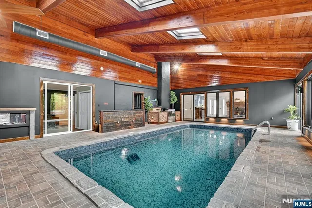 a view of swimming pool with seating area