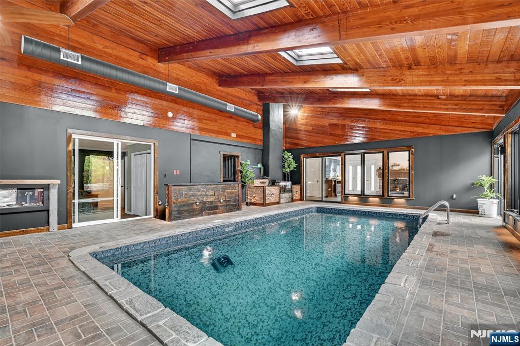 13 Main Street Paterson, NJ 07503 - Photo 9 of 46 a swimming pool with outdoor seating