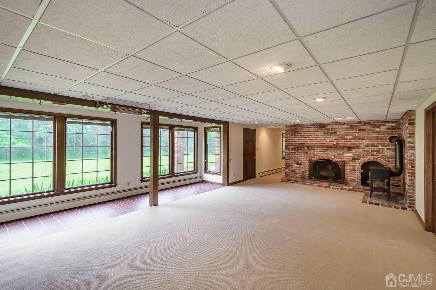 62 Linvale Road Ringoes, NJ 08551 - Photo 15 of 19 a view of an empty room with a fireplace and a window