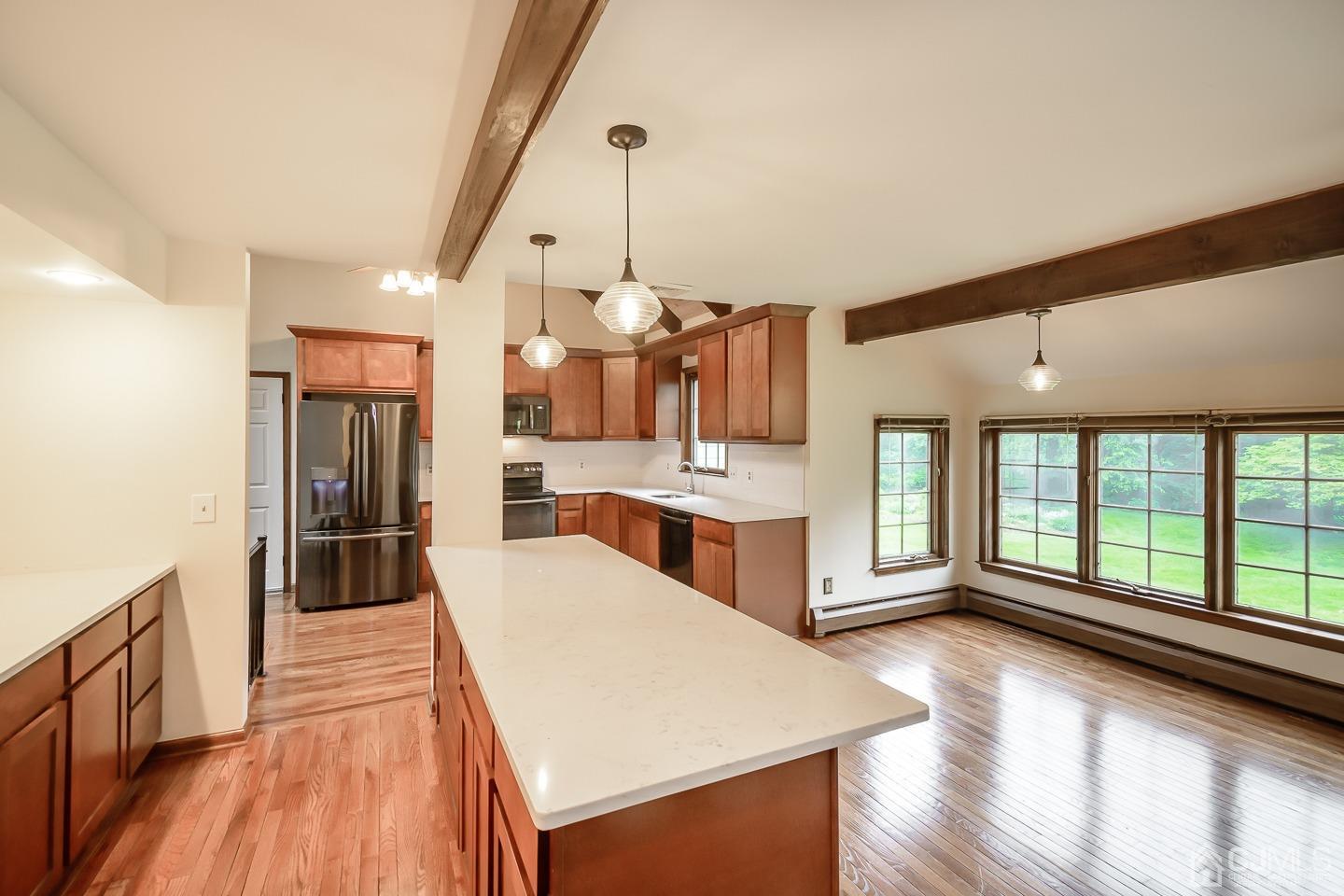 62 Linvale Road Ringoes, NJ 08551 - Photo 5 of 19 a large white kitchen with kitchen island a large counter space a sink appliances and cabinets
