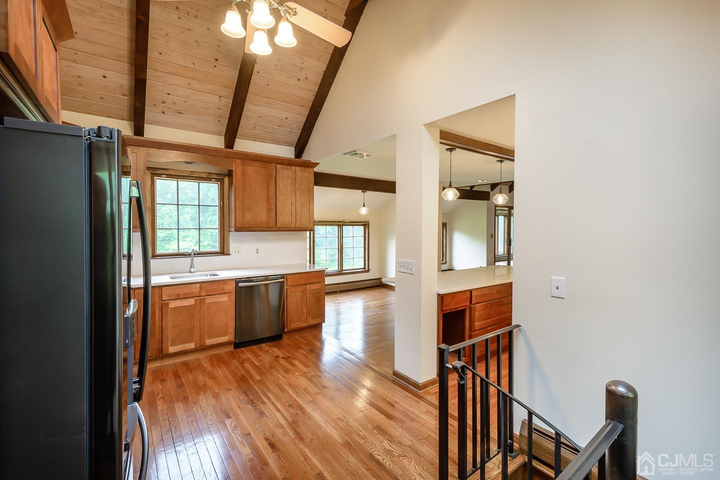 62 Linvale Road Ringoes, NJ 08551 - Photo 6 of 19 a large kitchen with a wooden floor and cabinets