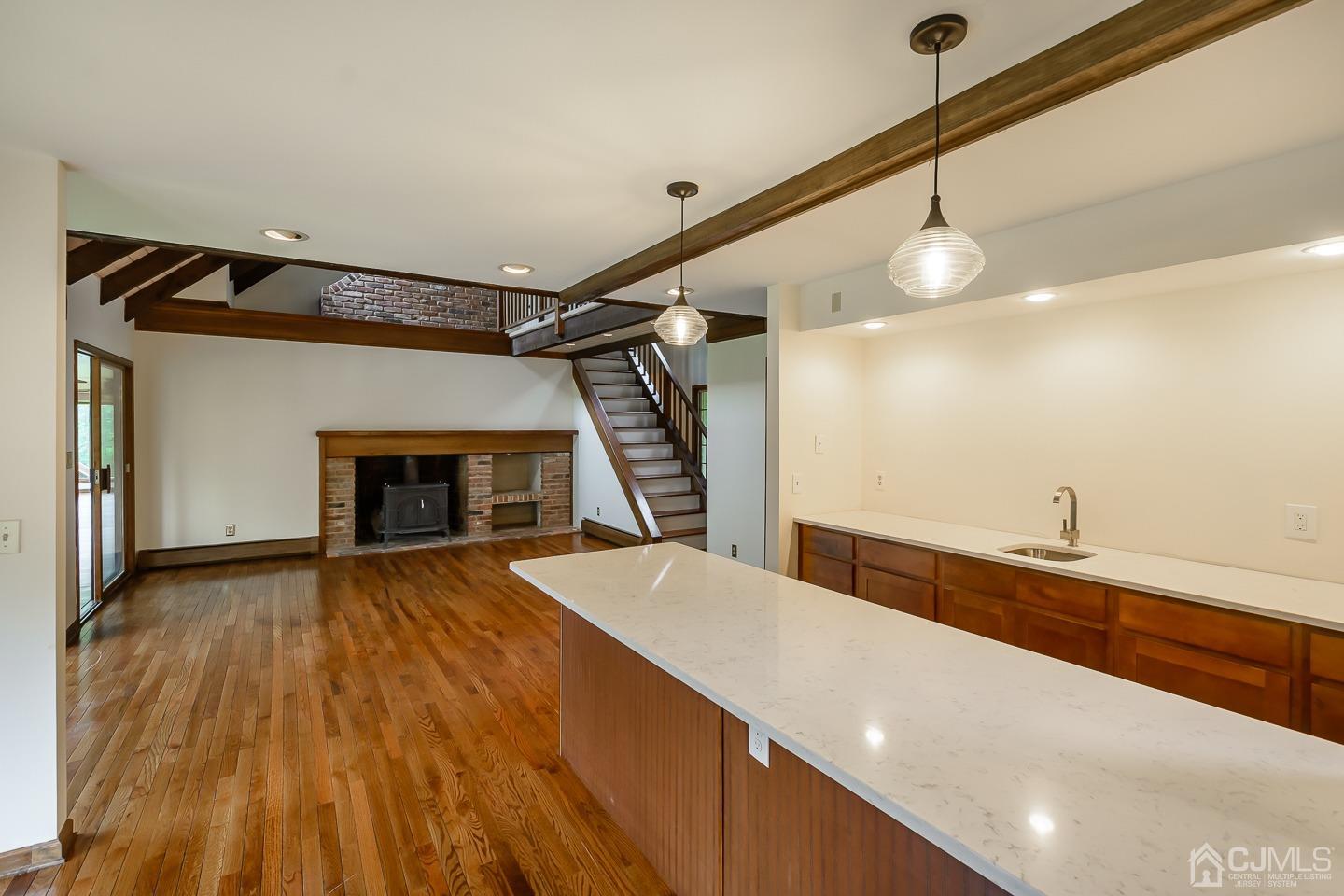62 Linvale Road Ringoes, NJ 08551 - Photo 7 of 19 a view of a room with wooden floor and staircase