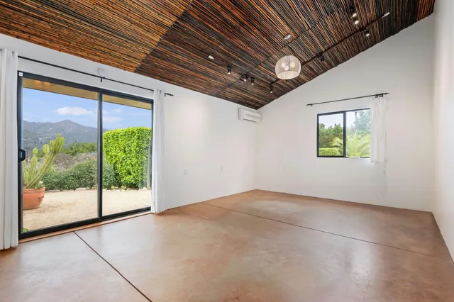 a view of an empty room with a window