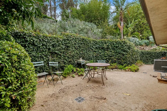 a view of a yard with furniture