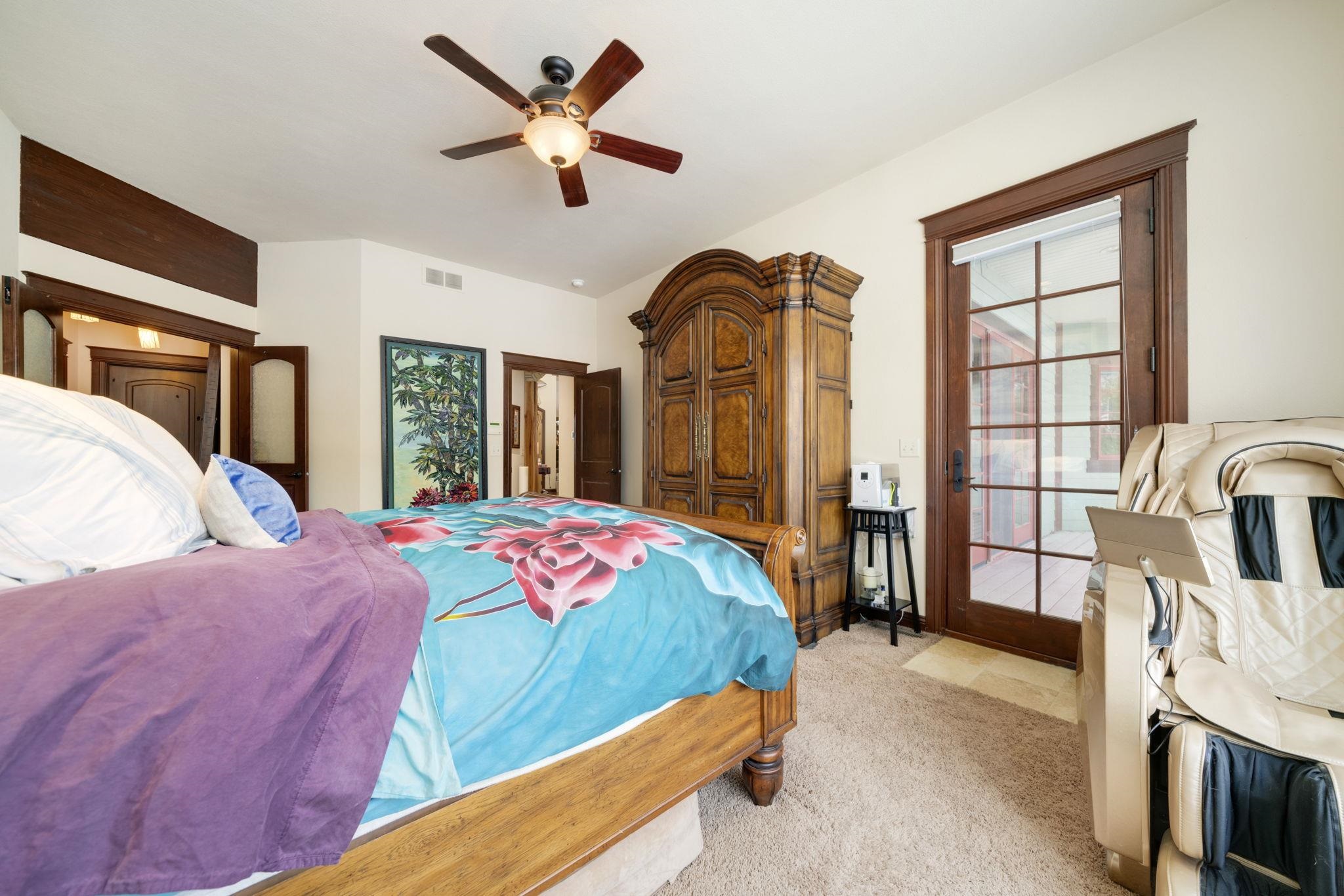 6871 Montague Road Rockford, IL 61102 - Photo 18 of 77 a bedroom with a bed a flat screen tv and a large window