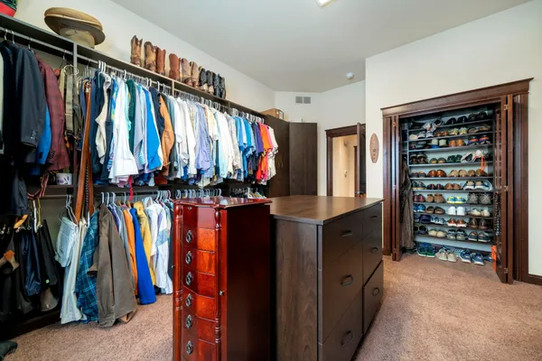 a kitchen with stainless steel appliances wooden cabinets a sink and a stove