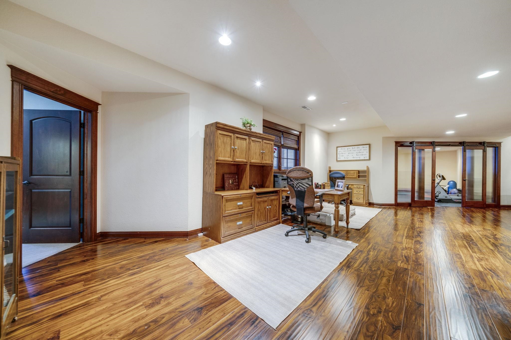6871 Montague Road Rockford, IL 61102 - Photo 62 of 77 a living room with furniture and a wooden floor