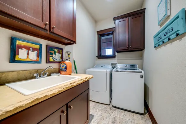 a living room with furniture and a pool table