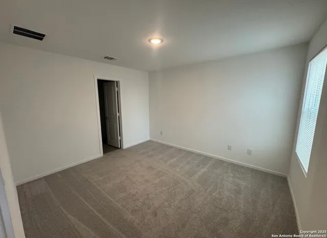 an empty room with a natural light