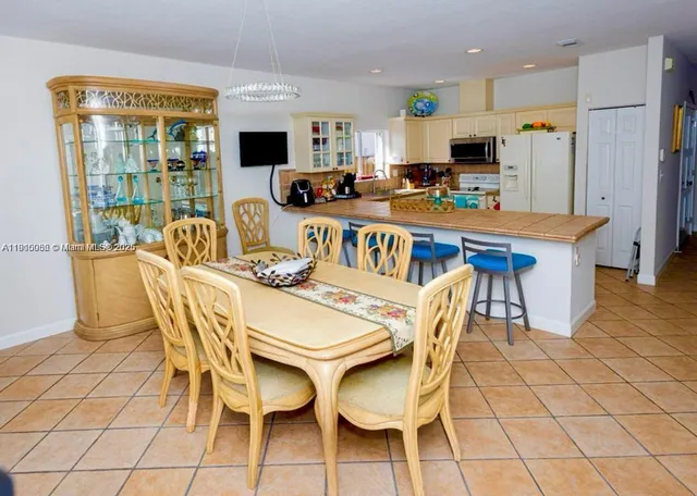 a bed room with a bed and a flat screen tv