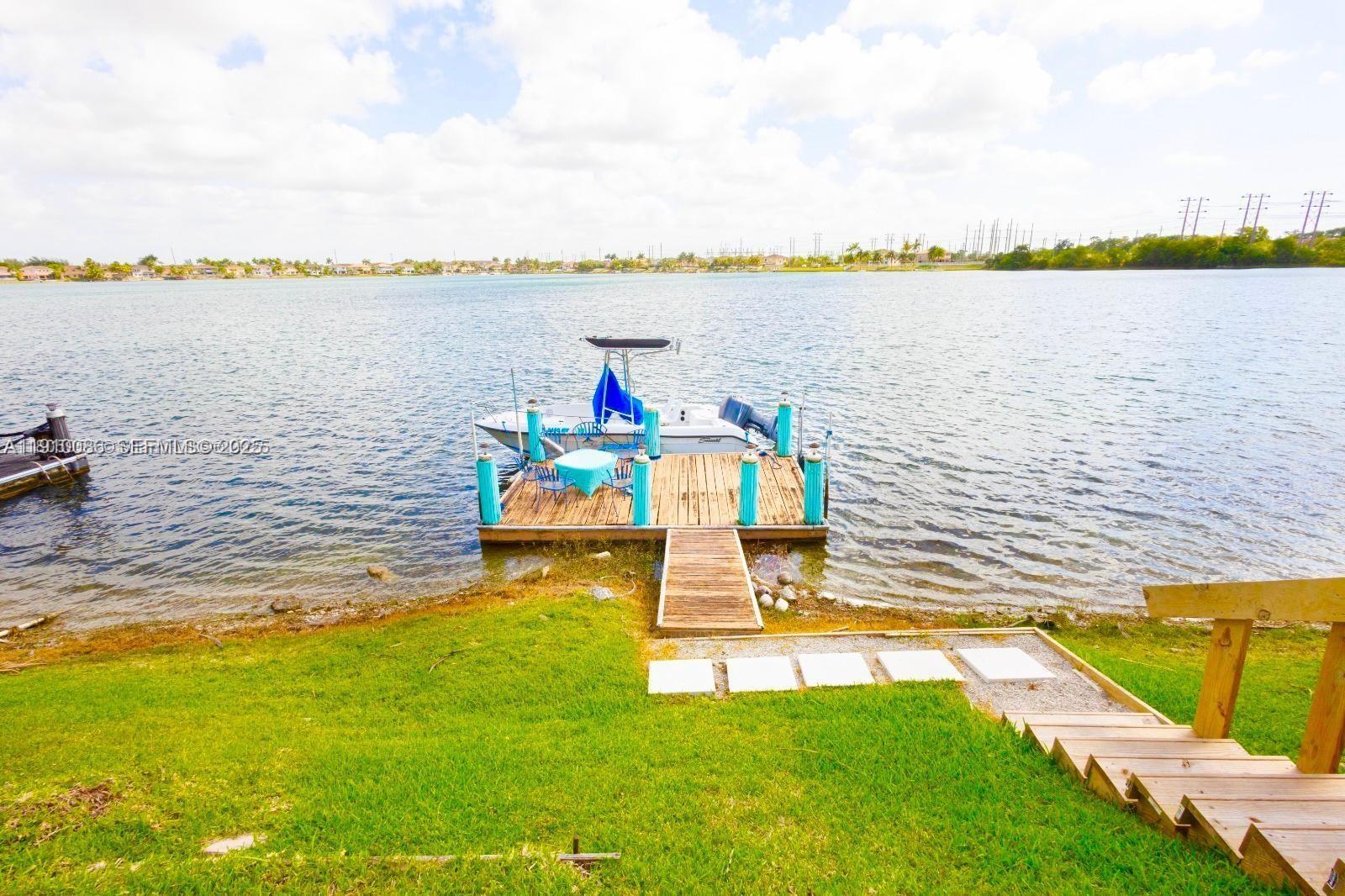 14241 Southwest 129th Avenue Miami, FL 33186 - Photo 20 of 24 a view of a lake with a large mountain