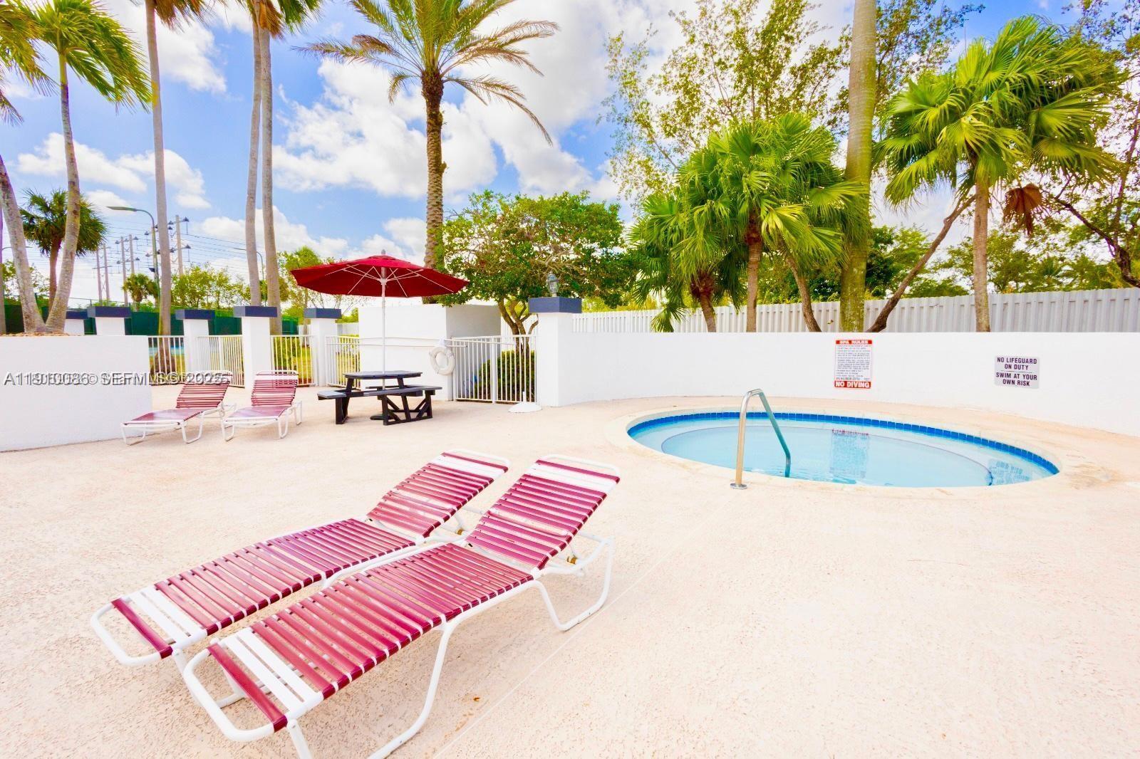 14241 Southwest 129th Avenue Miami, FL 33186 - Photo 24 of 24 a view of a swimming pool with a patio