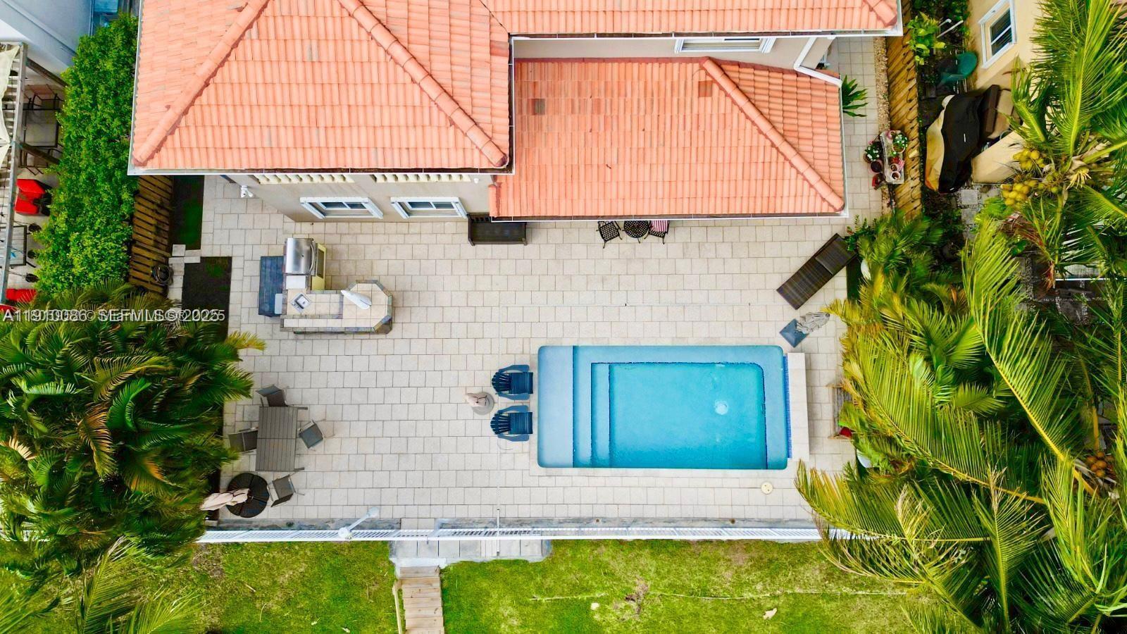 14241 Southwest 129th Avenue Miami, FL 33186 - Photo 6 of 24 a house view with a outdoor space