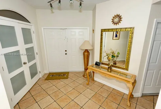 a living room with furniture ceiling fan and a rug