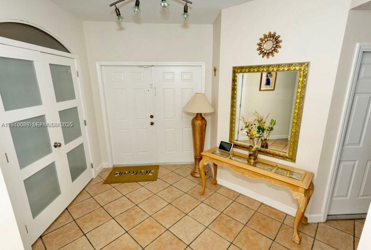 14241 Southwest 129th Avenue Miami, FL 33186 - Photo 7 of 24 a bathroom with a tub and a shower