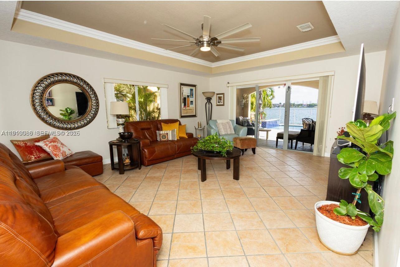 14241 Southwest 129th Avenue Miami, FL 33186 - Photo 9 of 24 a living room with furniture and a large window