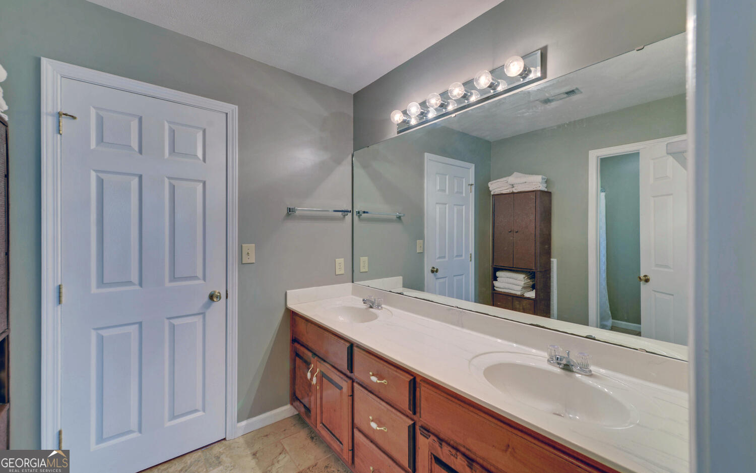 46 Cedar Ridge Drive Toccoa, GA 30577 - Photo 29 of 48 a bathroom with double vanity sink and a mirror