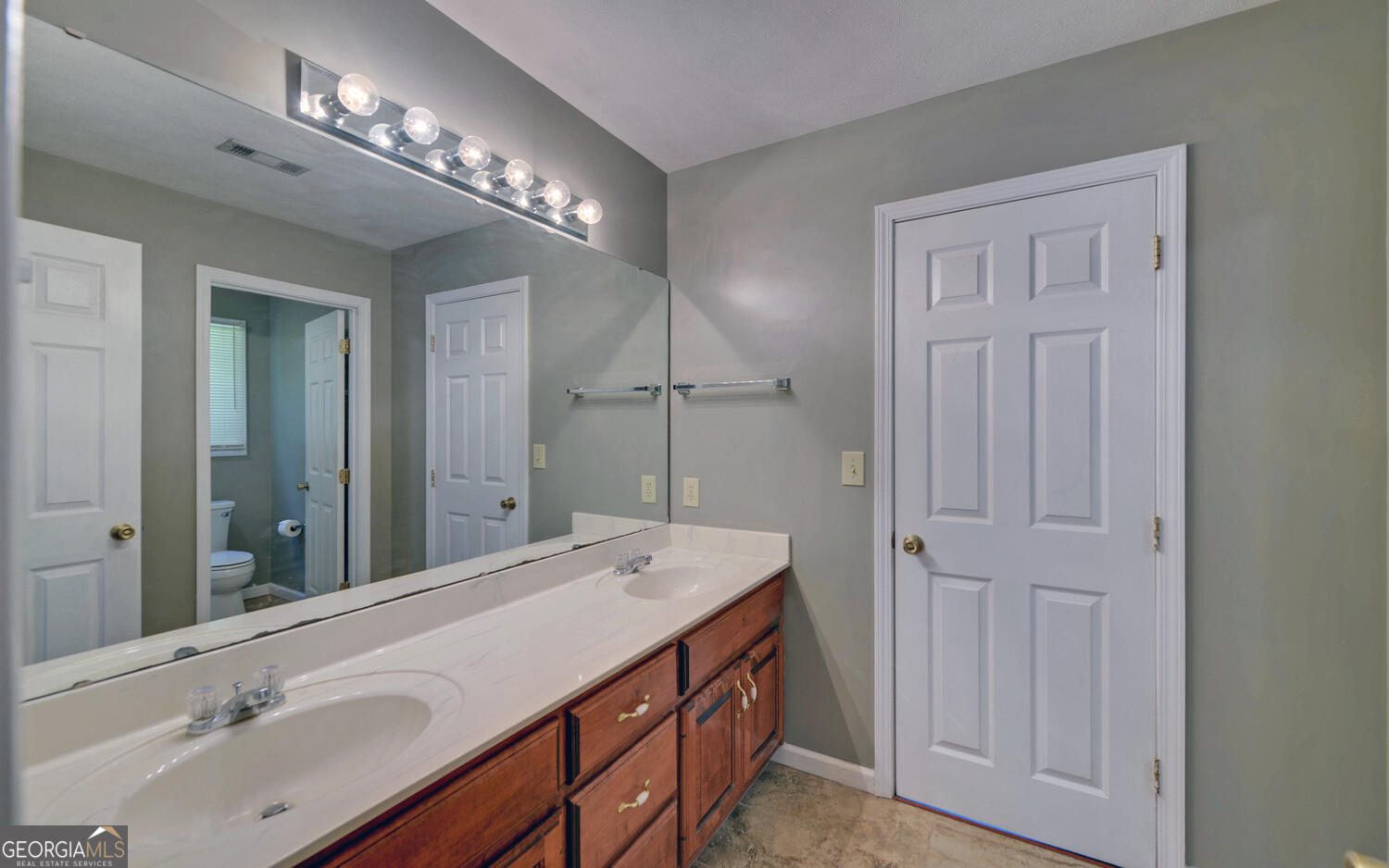 46 Cedar Ridge Drive Toccoa, GA 30577 - Photo 31 of 48 a bathroom with a double vanity sink and a mirror