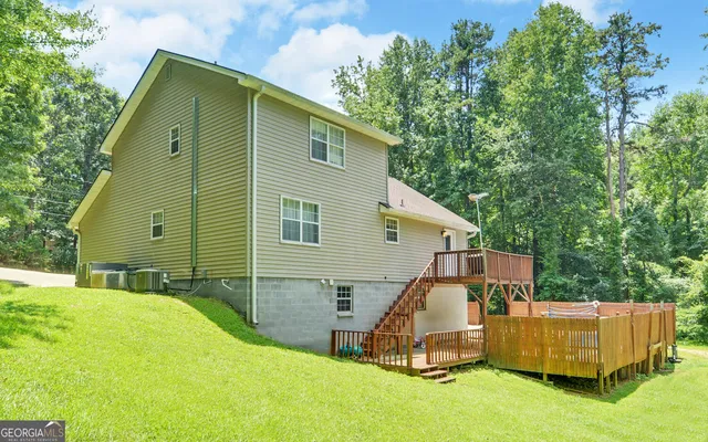 a view of backyard with a small cabin