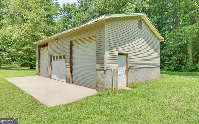 a backyard of a house with plants and garden